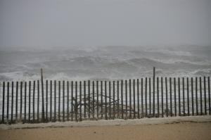 Looking more like an ocean, waves from Delaware Bay pound Lewes Beach early Monday morning. BY RON MACARTHUR