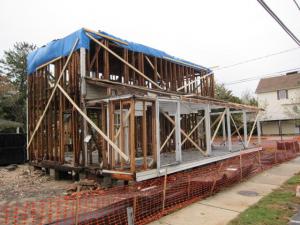 One of the roughest looking buildings in Rehoboth after Sandy is this house on First Street in the north end of town. Fortunately it's meant to look like this - in the earliest stages of restoration.