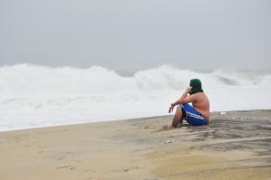 Connor Harper of Lewes takes a few minutes to soak in the storm. "I'm just enjoying the storm," he said. BY NICK ROTH