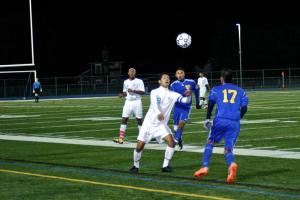 Davis Cespedes battles for ball with Brandon Sorto Lozano. BY REINE JOHNSON