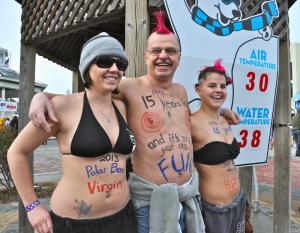 Winter weather doesn't bother this family as they prepare for the plunge. They are (l-r) Kelly, Kenny and Shannon Kreider of Wilmington. BY RON MACARTHUR