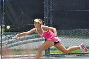 Fifth-seeded Jacqueline Cako lunges for a shot deep behind the base line. BY NICK ROTH