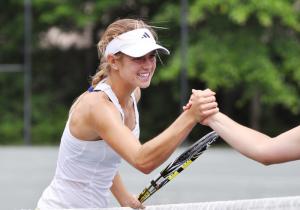 Peggy Porter shakes hands with Lena Litvak following her win in the quarterfinals. BY NICK ROTH