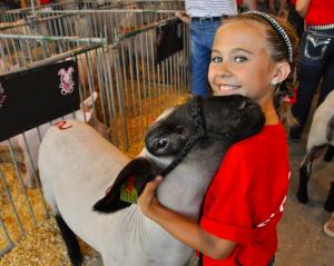 Sierra Jester of Houston is excited as she waits for the start of the July 23 Delaware State Fair Livestock Extravaganza, one of the top events on the busy fair schedule. Jester's sheep finished second in the heavyweight division. BY RON MACARTHUR