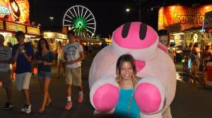 Somebody has to win the big prize. Lindsey Wong of Dover beat the odds and came away with a really big stuffed pig. BY RON MACARTHUR