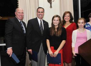 Recognized by the Sussex Family YMCA for their efforts raising money for the swim team and the YMCA were Claire Marshall and Ashlyn Warner. Both consummate salespeople also received tributes from the Delaware Senate and House. Shown are (l-r) Rep. Pete Schwarztkopf, D-Rehoboth; Sen. Ernie Lopez, R-Lewes; Claire Marshall; Michelle Marshall; and Ashlyn Warner. BY STEVEN BILLUPS