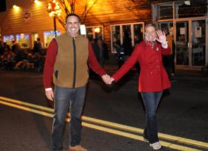 Senator Ernesto Lopez, R-Lewes, and his wife Janis greet the crowd at the Milton Christmas Parade. BY DAN COOK