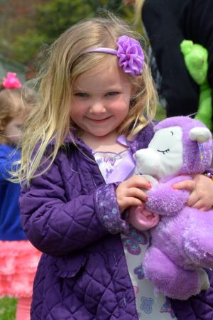 Alyssa Klase of Harbeson shows off the matching stuffed animal she found during the Midway Assembly of God's Easter egg hunt. BY RON MACARTHUR