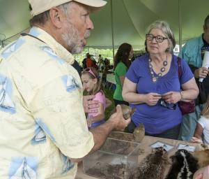 Steve Ferguson from Abbott's Mill Nature Center tells Linda Bosworth about the life of a box turtle. BY DENY HOWETH
