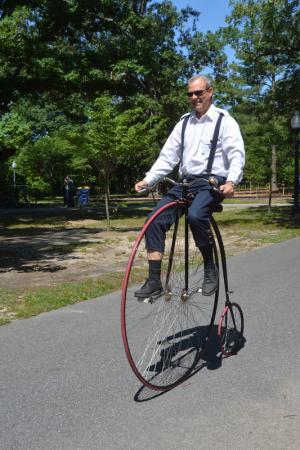 Jim Kohler of Hockessin says it took him about two hours to master riding this replica 1865 Victory high wheel. The hardest part is getting on and getting off, he says. BY RON MACARTHUR