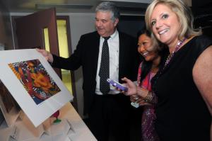 Browsing the silent auction items available at the auction are (l-r) Bill Purnell, Meaghan Hudson and Susan Weidman from the Law Offices of Susan Weidman. BY STEVEN BILLUPS