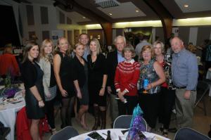 The Jack Lingo Realtor group eagerly awaits the highly competitive bidding at the live auction.Shown are (l-r) Molly Bayard, Melinda Ingram, Cheryl Crowe, Erin Stasi, Shaun Tull, Erica Tull, John Lingo, Carol Lingo Camilla Conlon, Kathy Wood and Greg Wood. BY STEVEN BILLUPS