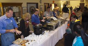 Delaware Seashore Parrot Head Club readies for the take out crowd during the community dinner at Lewes Presbyterian Fellowship hall. BY DENY HOWETH
