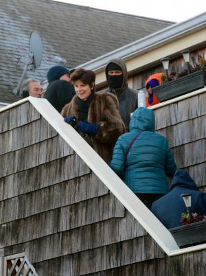 Dressed for the cold weather, those first in line wait for the owners of Agave Mexican Restaurant to open their doors on Black Friday. BY RON MACARTHUR