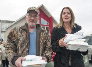 William McNeal and Catherine Vitale of Milton are thankful for the dinners provided by the church. BY DENY HOWETH