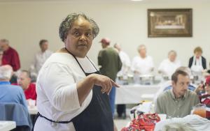 Hospitality committee member Myrtle Thomas keeps the traffic flowing at Thanksgiving dinner at Long Neck U.M. Church. BY DENY HOWETH