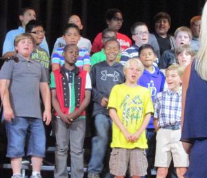 Students sing together in harmony during the choral concert. Shown in back are (l-r) Exavier Cephas, Malikye Wells, Samir Mohamed, Axel Trujillo and Daniel Heverin. In the third row are Andrew Martinez, Alvaro Vera-Garcia, Angelo Ballard-Rose, Alec Martin and Alex Horan. In the second row are Jonathan Scott, Zamson Delmas, Ronnie Lofland, Abran Hernandez and Devlin Stevenson. In front, Hayden Steeleman and Joshua Evans. SOURCE SUBMITTED