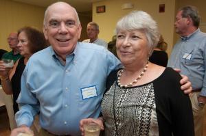 Sam Garde and Martine Downing look over auction items. BY DENY HOWETH
