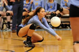 Cape senior Erin Walsh gets low to bump a dig in the third set. BY DAN COOK