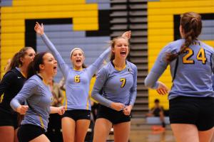 The Cape squad celebrates the win over Dover to move to 12-2 on the season. BY DAN COOK