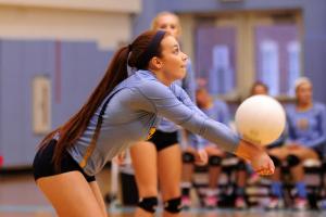 Defensive specialist Cassie Maiuri gets a dig. BY DAN COOK