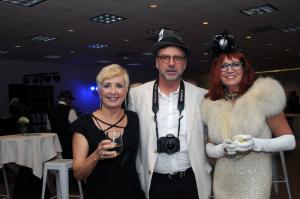 Kathy Sperl-Bell does her best Carol Brady look next to the paparazzi photog Bill Bell, with Jeannie Mack as Ginger from Gilligan's Island. BY STEVEN BILLUPS