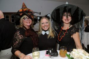 A black cat and her two witches enjoy the event. Shown are (l-r) Lynn Houska, Kari Glanden and Fran Fletcher. Fletcher has volunteered at Delaware Hospice for 22 years. BY STEVEN BILLUPS