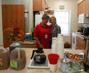 Shelter staff member Jennifer Rexroth, left, and executive assistant Alice Johnston pose for a photo in the new kitchen. BY MADDY LAURIA