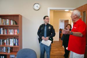 Volunteer Doug Welch, right, gives a tour of the new facility to Milton Police Department patrolman Nick Disciullo. BY MADDY LAURIA