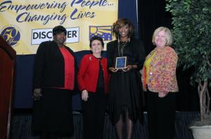 Kaneisha Trott, First State's Public Relations coordinator, received the Employee of the Year Award. Shown are (l-r) Executive Director Bernice Edwards, Board President Peggy Strine, Trott and Board Vice President Anne Farley. BY STEVEN BILLUPS