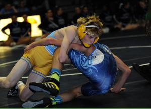 Freshman 113-pounder Anthony Caruso works for a pin at 3:18 over Kurt Moyer. BY DAN COOK