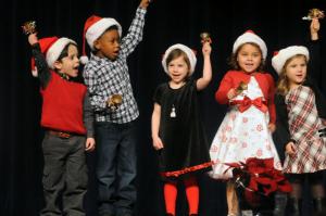 Ringing their bells while singing "Jingle Bells" are Lewes pre-K students (l-r) Isac Miranda, Kamari Hazzard, Erin Smith, Caitlyn Caulfield and Riley Windish. BY STEVEN BILLUPS