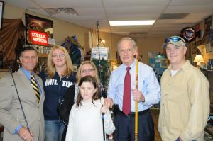 Taking a break to do a little holiday shopping are (l-r) state Rep. Steve Smyk, R-Milton, Wine Knot Shop owner Amy Conroy, Milton Chamber of Commerce Executive Director Lisa Sumstine and her 10-year-old daughter Kate, U.S. Sen. Tom Carper, and P.C. Rods owner Patrick Conroy. SOURCE SUBMITTED