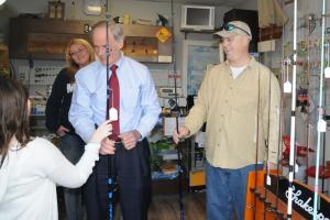 U.S. Sen. Tom Carper, center, recently toured Union Street's Wine Knot Shop and P.C. Rods, owned by Amy and Patrick Conroy of Milton. SOURCE SUBMITTED