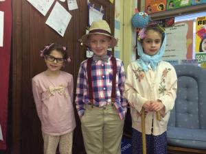 Showing off their 100-year-old outfits are (l-r) Francesca Mazzetti, Colton Donovan and Riley Grooms. SOURCE SUBMITTED