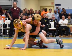 Cape's Anthony Caruso beams with excitement as he sees the clock strike zero and he wins the 106-pound state title. BY NICK ROTH