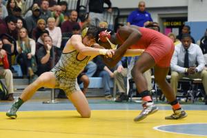 Cory Lawson grapples with his Smyrna opponent. BY NICK ROTH