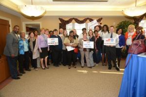 UWD and its community partners gather for a group photo. Shown in back are (l-r) Tami Wilson, Cheryl Douchette, Sandi Bowe, Tom Callahan, Peggy Geisler, Bernice Edwards and Randle Reed. In front are John Moore, Marie White, Lisa Coldiron, Susan Lloyd, Mary Randall, Sue Bernetich, Aleeshia Webster, Sheila Bravo, Amy Walls, Natasha Mullen, Kaneisha Trott, David Morris, Schlonn Hawkins, Debbie Armstrong, and Christella St. Justen. BY STEVEN BILLUPS