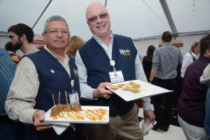 Beebe Healthcare volunteers kept the many fine hors d'oeuvres circulating throughout the tent. Shown are Frank Rogers and Richard King. BY STEVEN BILLUPS