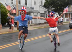 Brother and sister Billy and Hope Halleck perform on their unicycles along Savannah Road. RON MACARTHUR PHOTO