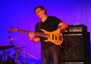 Jeff Lorber Fusion bassist Jimmy Haslip performs a solo during the concert Oc.t 15 at Rehoboth Elementary. DAN COOK PHOTO