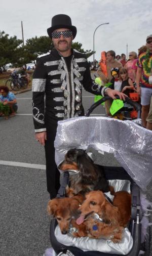 Dan Foskey of Lewes takes on the persona of Elton John with his three long-haired dachshunds along for the ride. RON MACARTHUR PHOTO