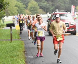 Doug White, 74, of Hockessin leads a group of runners in the final mile. NICK ROTH PHOTO