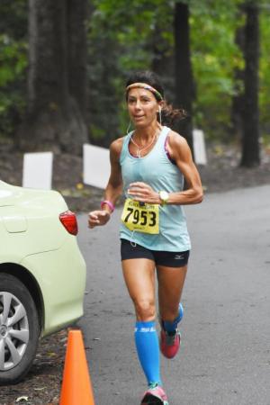 Masters winner Meryl Ludwig sprints to the finish line. NICK ROTH PHOTO