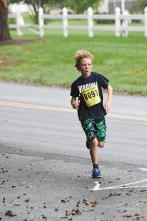Carter Miklus rounds the final turn. He finished in 24:04. NICK ROTH PHOTO