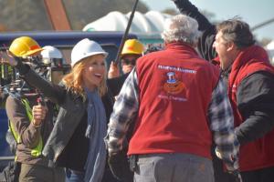 Science Channel host Kari Byron reacts after a long shot by the Punkin Hammer team on the second day of competition. The 2,509-foot shot took the team from last place to first place in the trebuchet division. RON MACARTHUR PHOTO