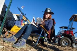 Becky Miller, a member of the Big 10 Inch air cannon team, paints scenes in the pits. RON MACARTHUR PHOTO