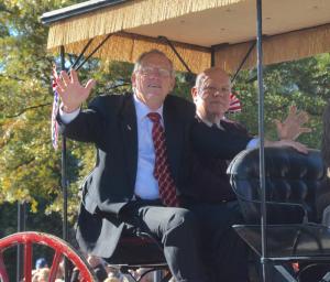 Republican 41st District Rep. Rich Collins, left, and challenger Brad Connor ride together in a carriage. RON MACARTHUR PHOTO
