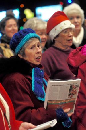 Members of the Village Improvement Association bring in the season with their voices. Singing are (l-r) Fay Kempton and Kathy Osterholm and in the back row are Mary Folan and Roxanne Nelson. RON MACARTHUR PHOTO