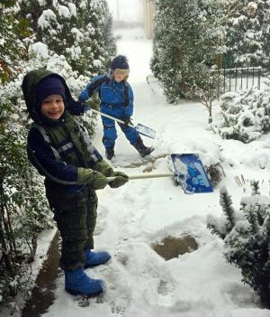Oliver L'Armand, 7 and his brother Sidney, 5 enjoyed helping shovel at their home in Greenwood. LORI L’ARMAND PHOTO